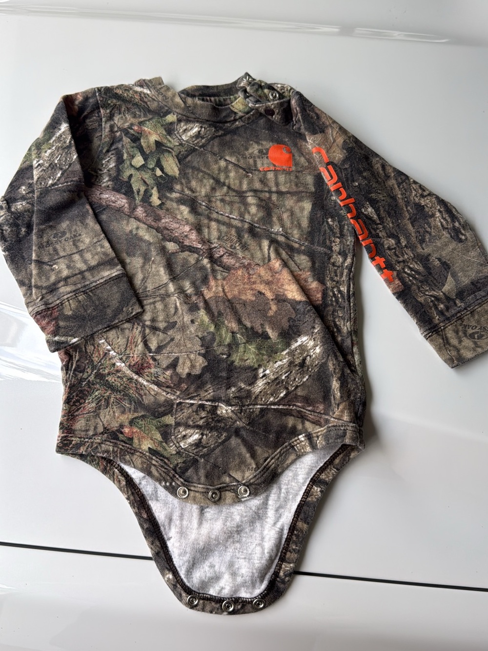 Carhartt Brown and Green Camo Long-Sleeve One-Piece Bodysuit with Orange Logo